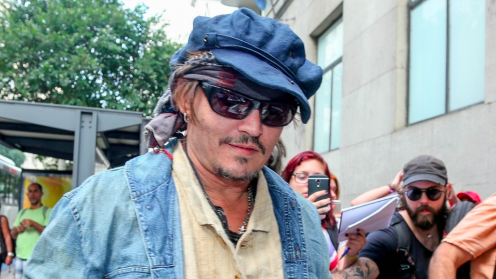 Johnny Depp Goes on Rock Tour in Ray-Ban RB4149