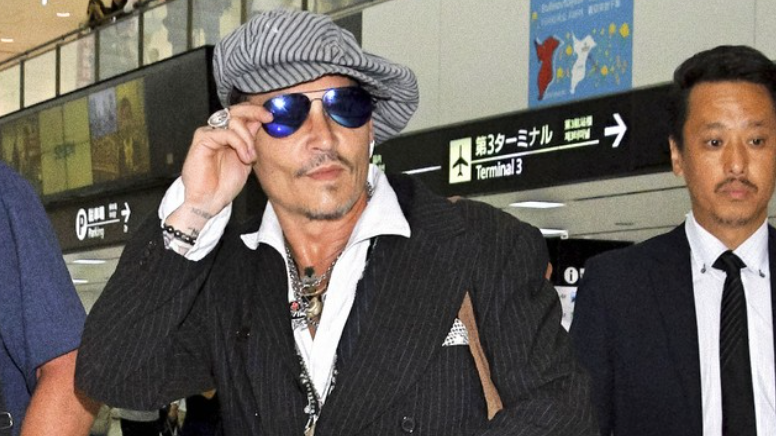 Tokyo Chic: Johnny Depp Lands in Japan Wearing Ray-Ban Aviator Large Metals