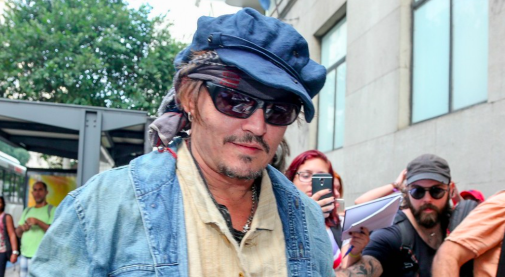 Johnny Depp Goes on Rock Tour in Ray-Ban RB4149
